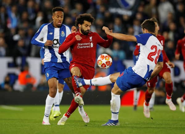 Soccer Football - Champions League Quarter Final First Leg - Liverpool v FC Porto - Anfield, Liverpool, Britain - April 9, 2019  Liverpool's Mohamed Salah in action with FC Porto's Felipe  REUTERS/Phil Noble