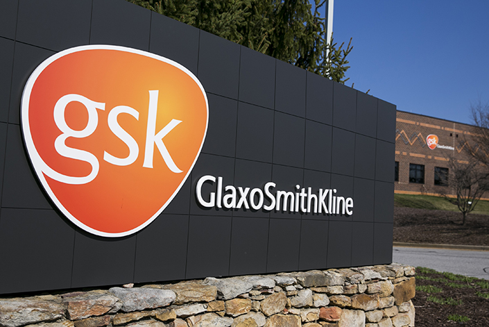 A logo sign outside a facility occupied by GlaxoSmithKline, in Rockville, Maryland on April 4, 2015. Photo credit: Kristoffer Tripplaar/ Sipa USA *** Please Use Credit from Credit Field ***