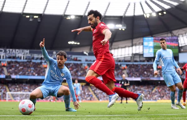 Soccer Football - Premier League - Manchester City v Liverpool - Etihad Stadium, Manchester, Britain - April 10, 2022 Liverpool's Mohamed Salah in action with Manchester City's Bernardo Silva Action Images via Reuters/Carl Recine EDITORIAL USE ONLY. No use with unauthorized audio, video, data, fixture lists, club/league logos or 'live' services. Online in-match use limited to 75 images, no video emulation. No use in betting, games or single club /league/player publications.  Please contact your account representative for further details.