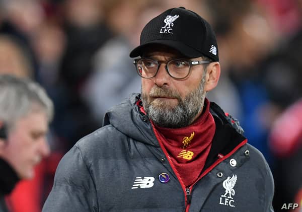 Liverpool's German manager Jurgen Klopp arrives for the English Premier League football match between Liverpool and Everton at Anfield in Liverpool, north west England on December 4, 2019. (Photo by Paul ELLIS / AFP) / RESTRICTED TO EDITORIAL USE. No use with unauthorized audio, video, data, fixture lists, club/league logos or 'live' services. Online in-match use limited to 120 images. An additional 40 images may be used in extra time. No video emulation. Social media in-match use limited to 120 images. An additional 40 images may be used in extra time. No use in betting publications, games or single club/league/player publications. /
