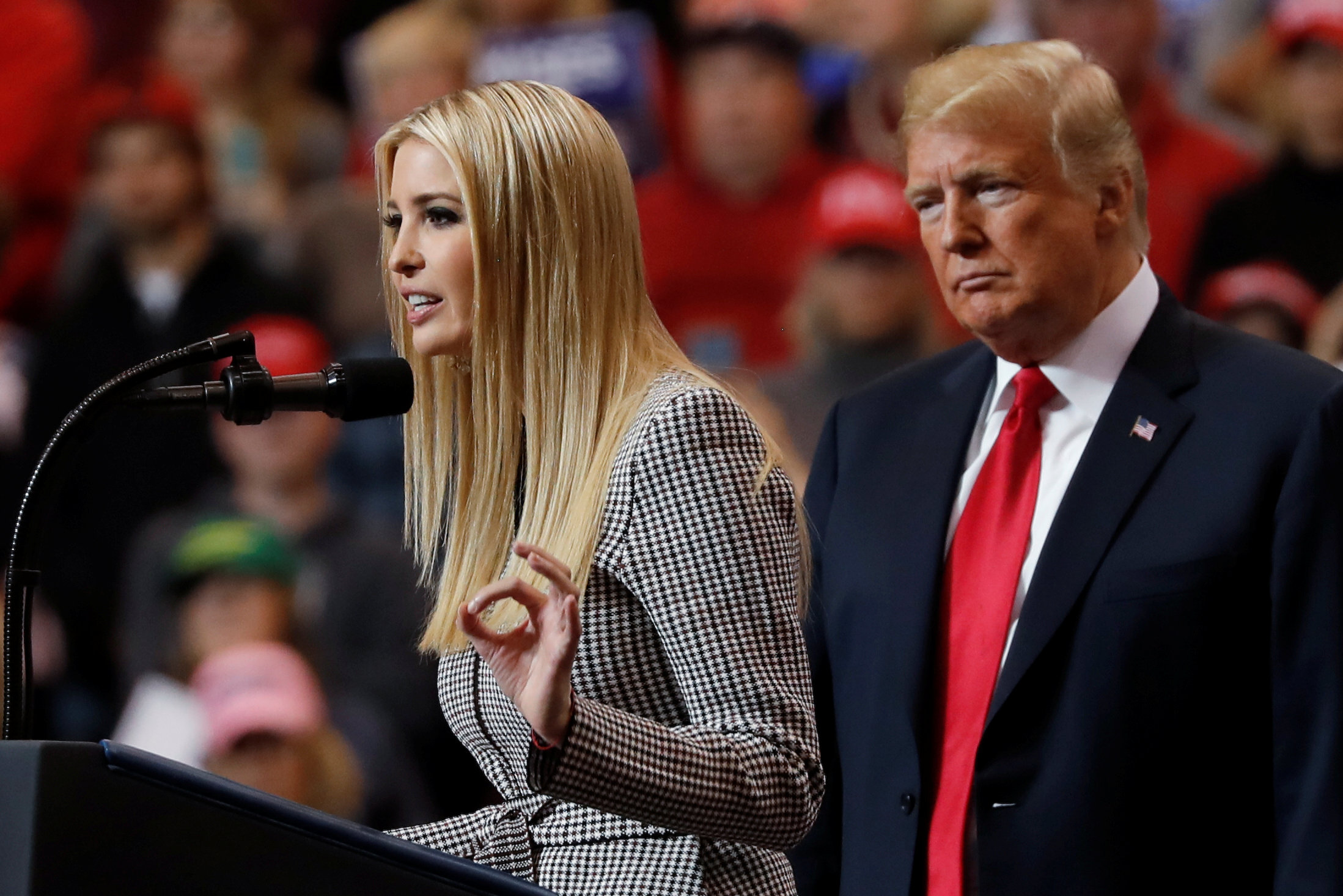 U.S. President Donald Trump listens as his daughter, White House senior adviser Ivanka Trump, speaks during a campaign rally in Cleveland, Ohio., U.S., November 5, 2018. REUTERS/Carlos Barria