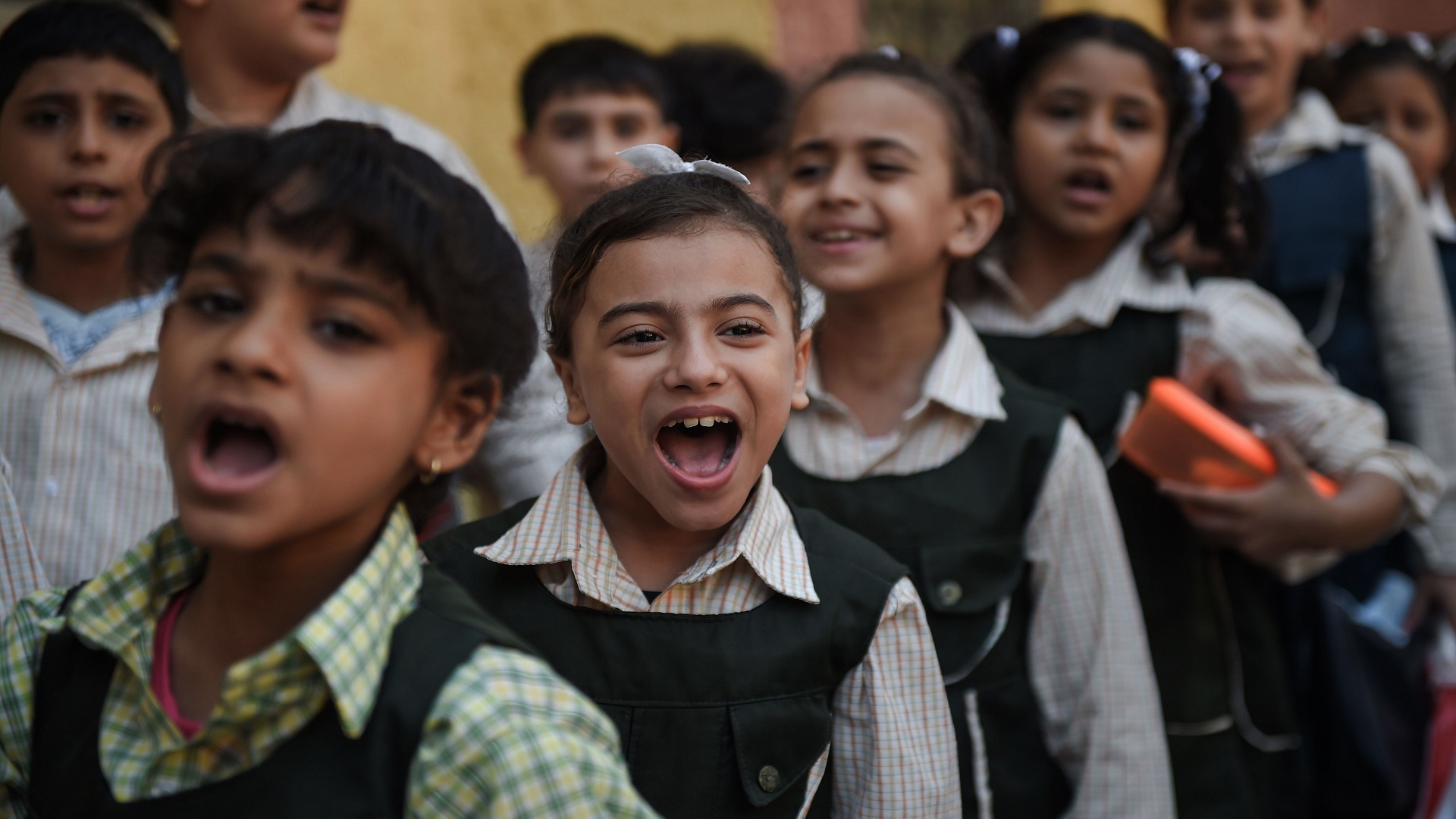 Pupils line up in the courtyard of the Mahaba school in Ezbet al-Nakhl, a shanty town north of the Egyptian capital Cairo on October 13, 2018. - In a Cairo slum the poorest of Egypt's poor who eke out a living as scavenging through garbage have been struggling to keep their children in school and lead them out of their misery.
Mahaba, love in Arabic, was set up 30 years ago in Ezbet al-Nakhl by French nun Sister Emannuelle whom the Vatican once compared to Mother Teresa for her charitable work with slum dwellers. (Photo by Mohamed el-Shahed / AFP)        (Photo credit should read MOHAMED EL-SHAHED/AFP/Getty Images)