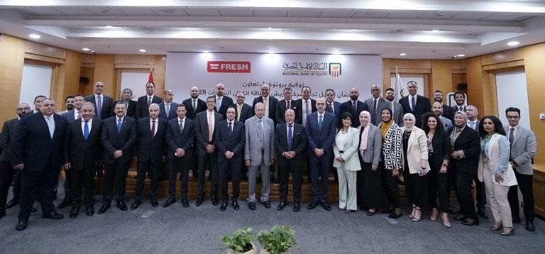 تعاون بين البنك الأهلي وشركة فريش لتمويل التجار ببطاقة ائتمان الشركات