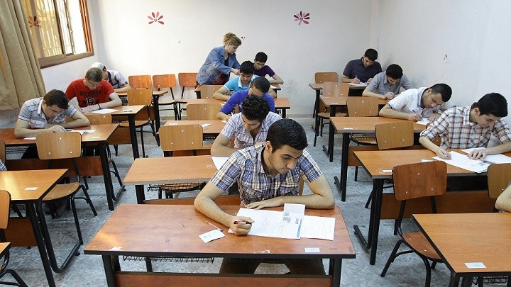 Syrian students sit their end of year exams at a high school in the capital Damascus, on June 18, 2013. Across Syria students are sitting their exams at sate-run schools, after which, if successful, they will continue their education at a university. AFP PHOTO / LOUAI BESHARA        (Photo credit should read LOUAI BESHARA/AFP via Getty Images)