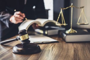 Judge gavel with Justice lawyers, Lawyer or Judge counselor working with agreement contract in Courtroom, Justice and Law concept.